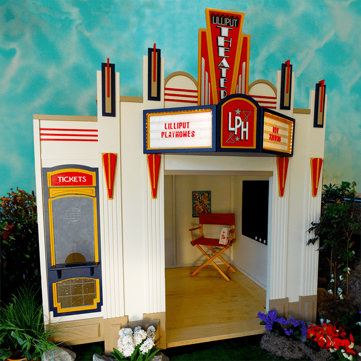 The Main Street Theater is a miniature playhouse featuring a vintage marquee, ticket booth, director’s chair, and decorative plants, capturing the nostalgic charm of classic theater.