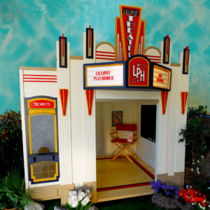 Main Street Theater features a Lilliput Theater facade with custom signage, a left-side ticket booth.. Its colorful design draws inspiration from art deco, celebrating the glamorous era of classic theater. The Theater is ideal for any children's indoor playtown or play village.