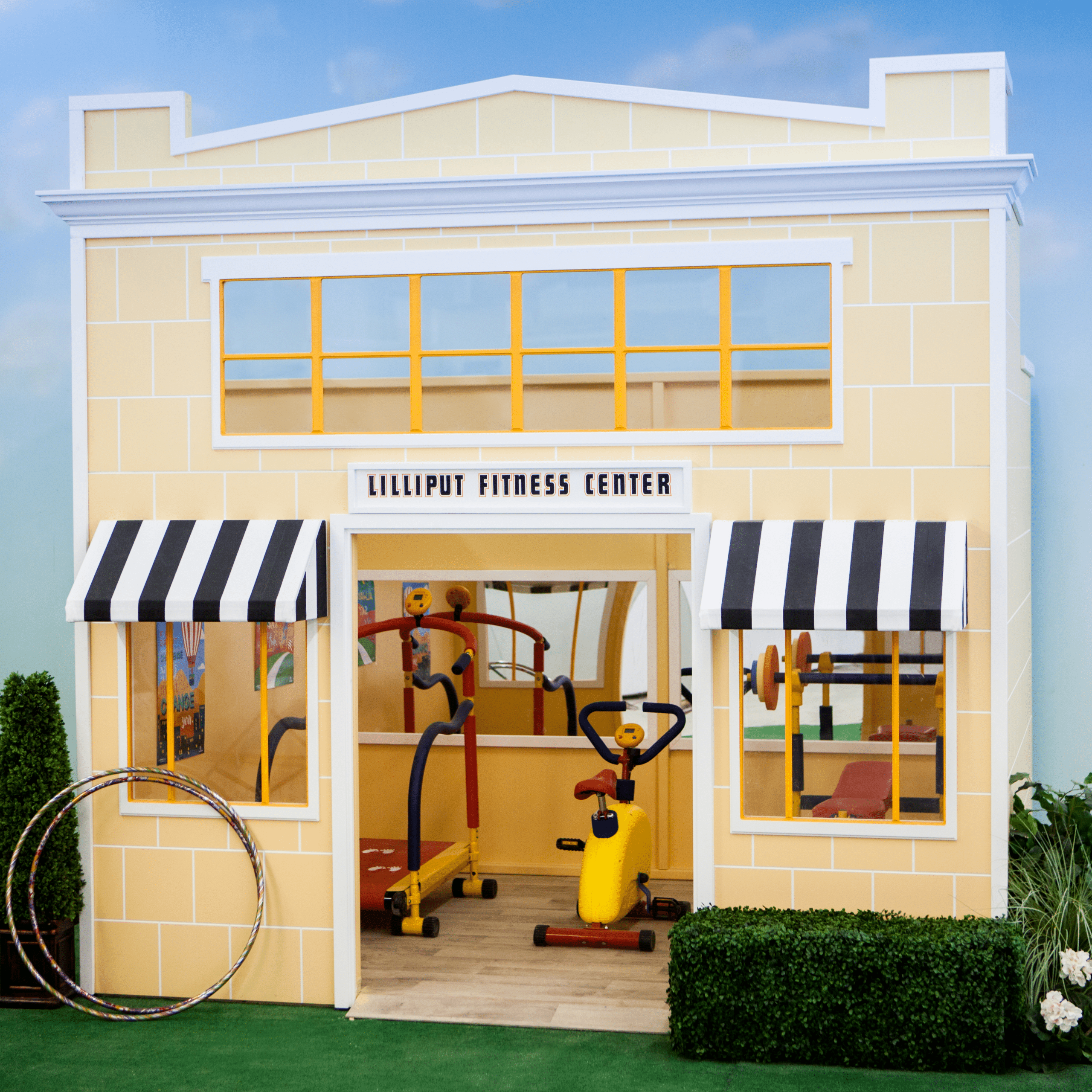 Lilliput's Uptown Fitness Center designed for interactive play with play exercise equipment, large mirrors and motivational posters, it is a great compliment to complete any play village or town area.