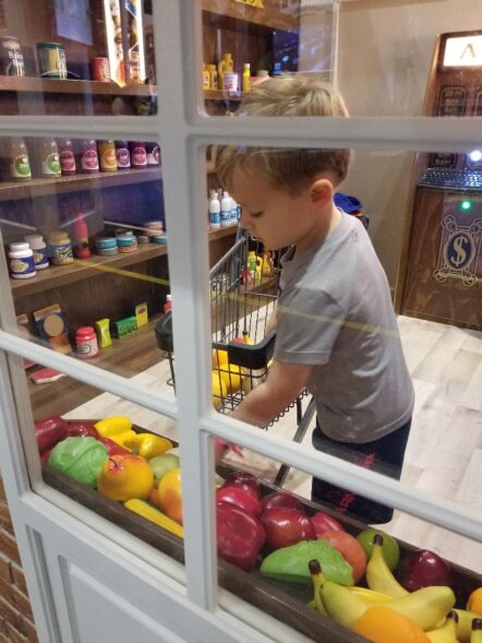 Grocery Market with boy at window