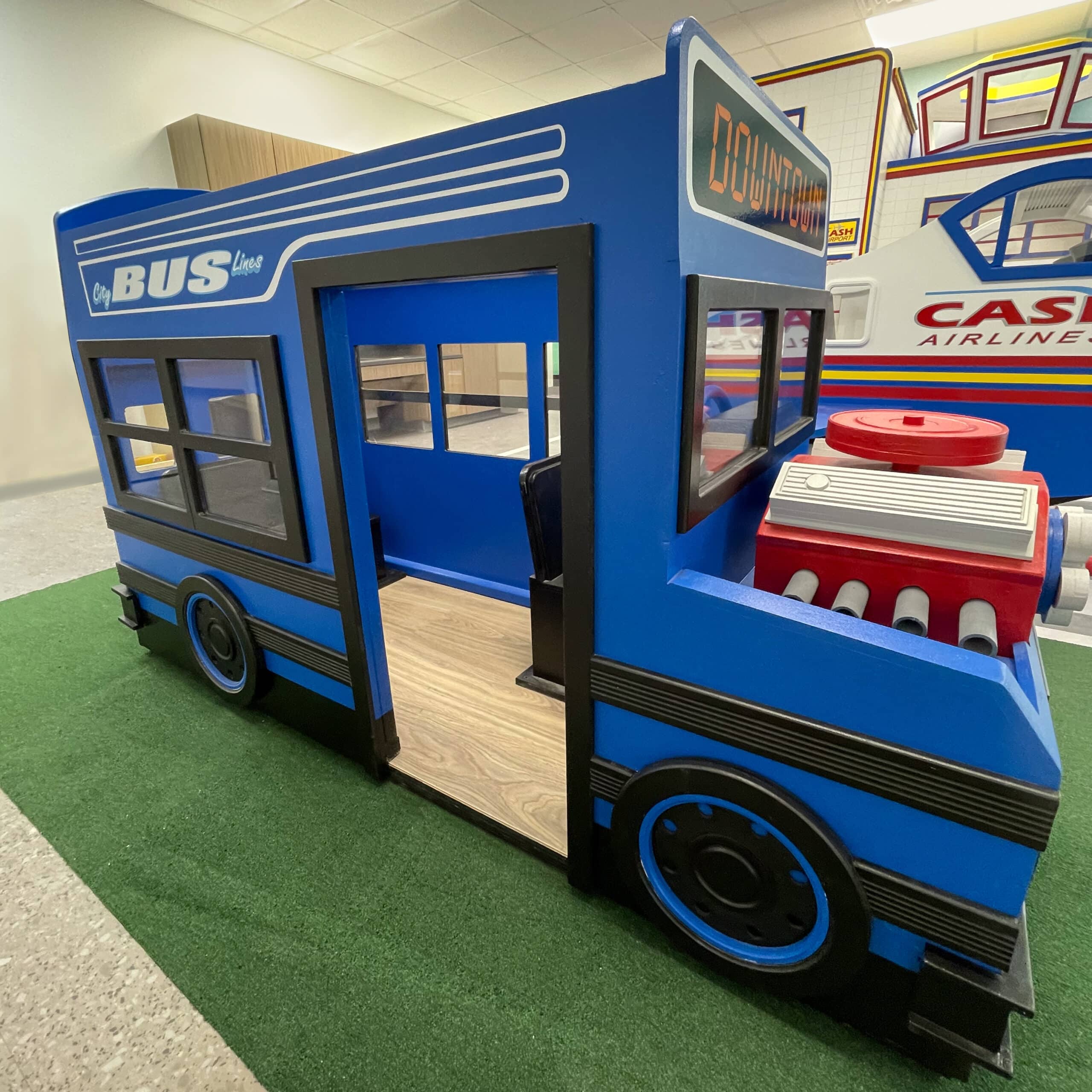 An alternative to Lilliput's school bus is this city bus. Shown in a bright blue with a sign reading "Downtown". It features an interactive engine for children to take apart and play.
