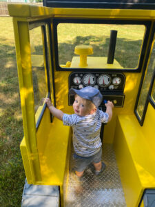 Little Buddy Bulldozer with small boy playing with the controls