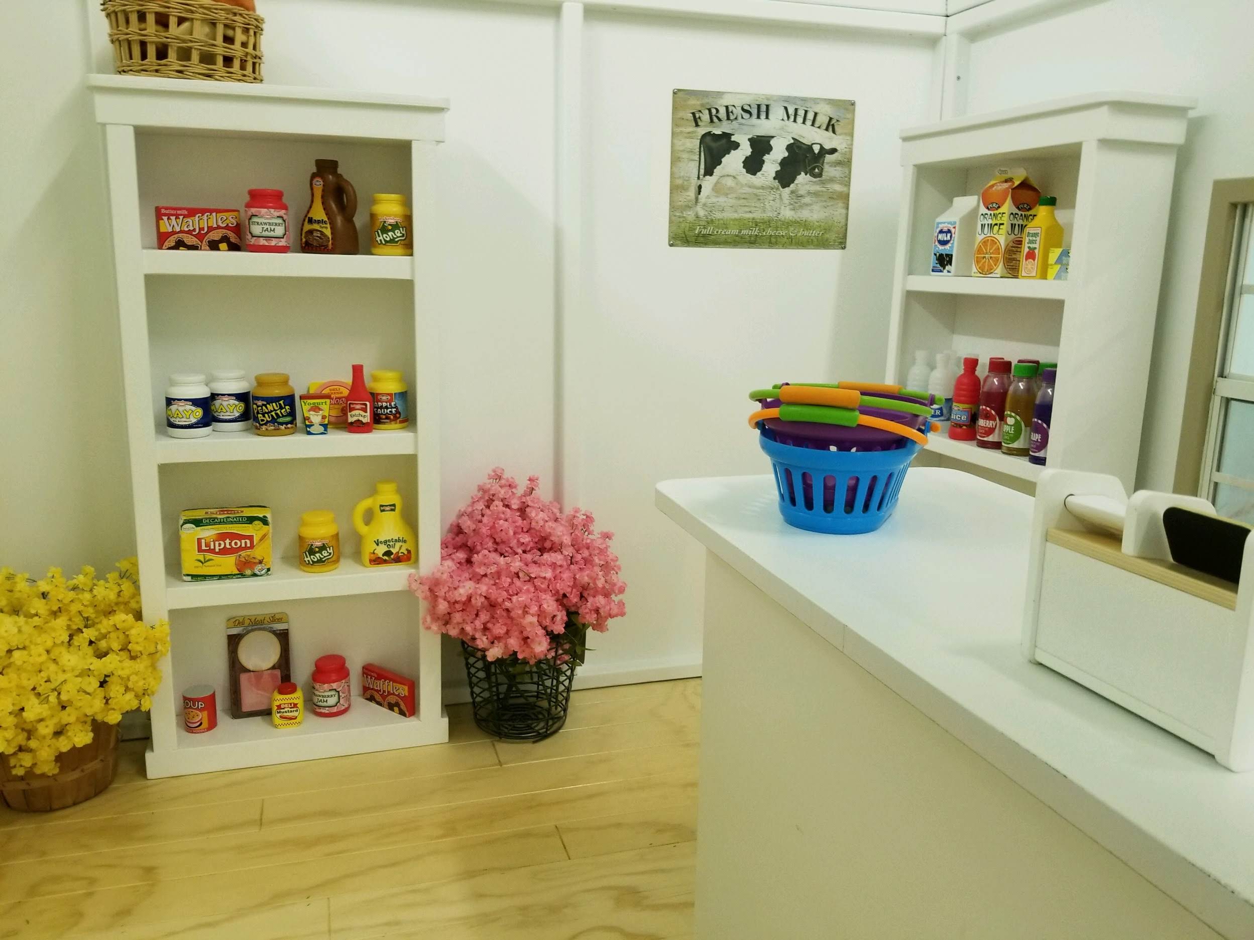 Furniture created to outfit a grocery market playhouse .