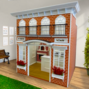 Exterior view of the Main Street Cafe playhouse designed to mimic a brick café with arched windows, black faux metal railings, and window boxes with red flowers. It features indoor seating easily accessible for children.