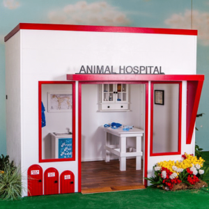 Lilliput's Uptown Animal Hospital features a modern sleek design with a straight awning, large windows, small pet doors, and hand-built child-size furnishings.